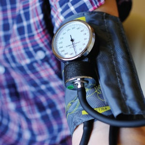 A person is checking their blood pressure. Studies show that there are links between BPA and high blood pressure.