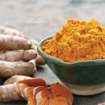 A bowl of organic turmeric powder. Turmeric also been shown to support brain health, thyroid health, and encourage a balanced mood.