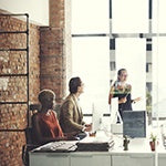 It's a glass room filled with employees having a good meeting. Healthy and positive work enviroment is vital for your health