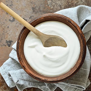 A bowl of yogurt. Foods like yogurt contain probiotics which is one of the natural remedies for yeast infection.