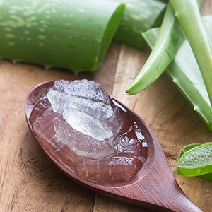 A spoon of aloe vera. Inner aloe vera leaf gel supports digestion and is another great alternative for soothing acid reflux.