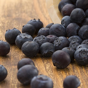 Blueberries on a table. Antioxidants are found in foods like fruits and vegetables and can also help fight free radicals.