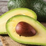 A slice of an organic avocado. Biotin is a water-soluble B vitamin required by every cell in the body.