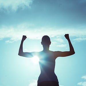 An individual staring at the sun. Vitamin D can help with calcium deficiency.