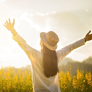 An individual is looking at the sun. Catalase may help prevent DNA damage.