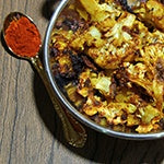 Bowl of Chipotle-lime Roasted Cauliflower, a vegan cauliflower recipe rich in both potassium and vitamin C.