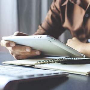 A woman using a smart tablet.