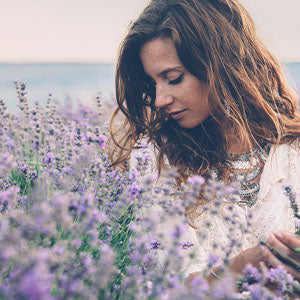 A woman in a field of lavender.