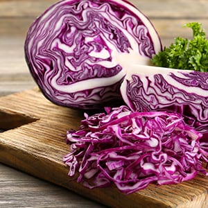 A red cabbage on the table. Nutrient Absorption and brain health are one of many Glutamine Benefits.