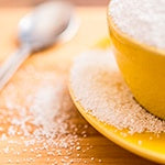 A jar full of sugar. Sugar and artificial sweeteners can affect your gut health in a negative way.