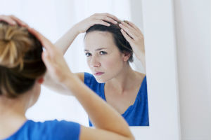 woman-looking-in-mirror