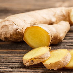 A pile of sliced ginger. One of the many health benefits of ginger is that it helps protect the digestive tract.