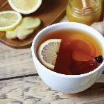 A cup of tea with honey. Tea with honey is one of the many natural remedies for a sore throat.