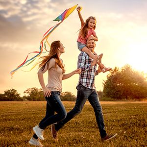 A family playing in the park.