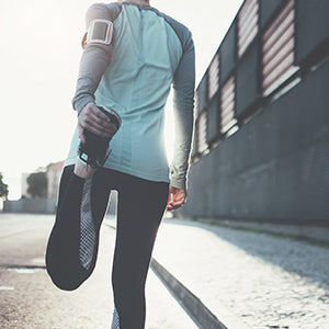 An individual stretching. Regular aerobic exercise can help reduce your cortisol and stress levels.