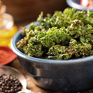 A bowl of kale chips for a healthy, nutritious snack.