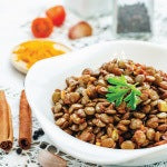 A bowl of lentil salad with roasted potatoes and asparagus. This delicious vegan-friendly recipe contains many key nutrients.