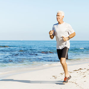 A man running on the beach.