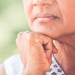 An elderly woman thinking. One of the most difficult issues some women face during menopause is a loss of libido and hot flashes.