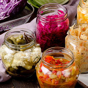 Four jars of fermented food. Probiotics can help fight against cold and flu.