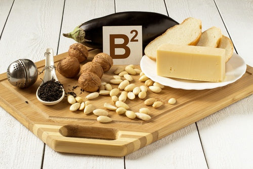 Riboflavin is a B vitamin required to metabolize fat and protein, which can be found in foods such as cheese, nuts, and bread.