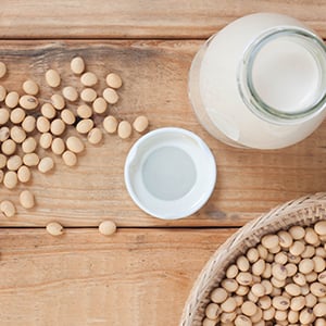 A table full of soybeans. Most soy products are not real food — most are highly processed and genetically modified.