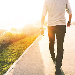 A man walking on a trail.