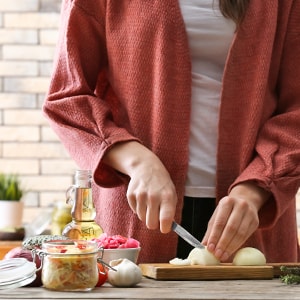 A woman chopping food.