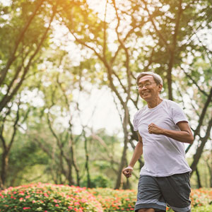 A man running on a nature trail.