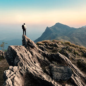 A man hiking on mountains.