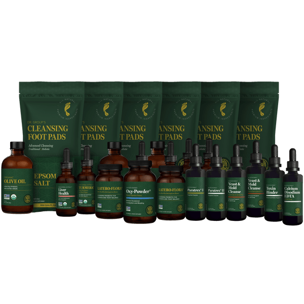 The Complete Body Cleanse Program including bottles and detox foot pads on a black background